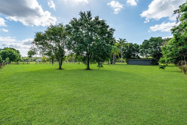 view of yard with a rural view