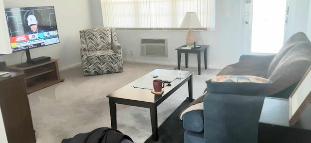 living room featuring carpet floors, a wall unit AC, and a wealth of natural light