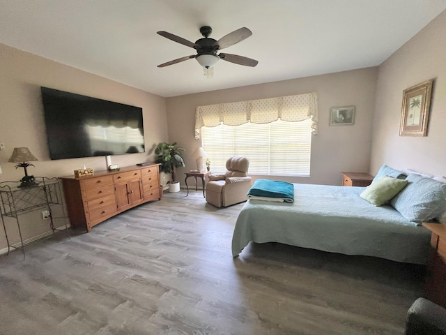 bedroom featuring ceiling fan and light hardwood / wood-style flooring