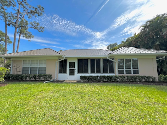 ranch-style house with a front lawn