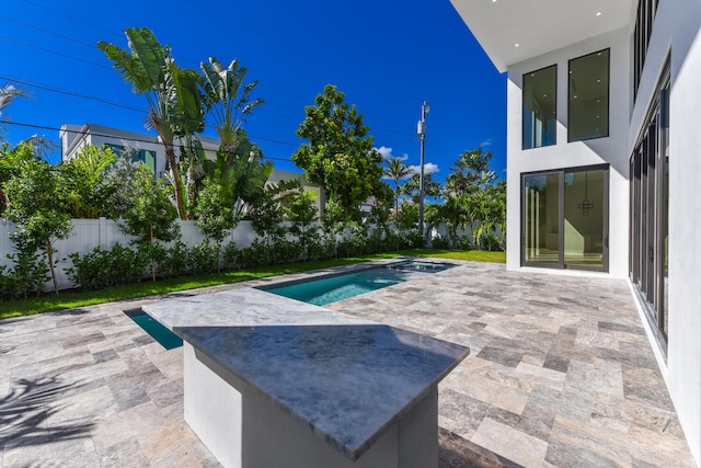 view of swimming pool featuring a patio