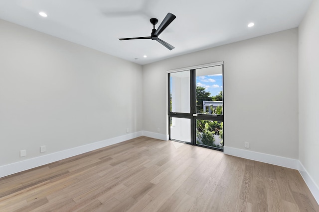 unfurnished room featuring ceiling fan and light wood-type flooring