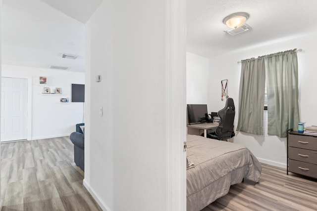 bedroom featuring light hardwood / wood-style floors