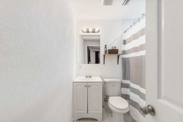 bathroom with vanity, a shower with curtain, and toilet