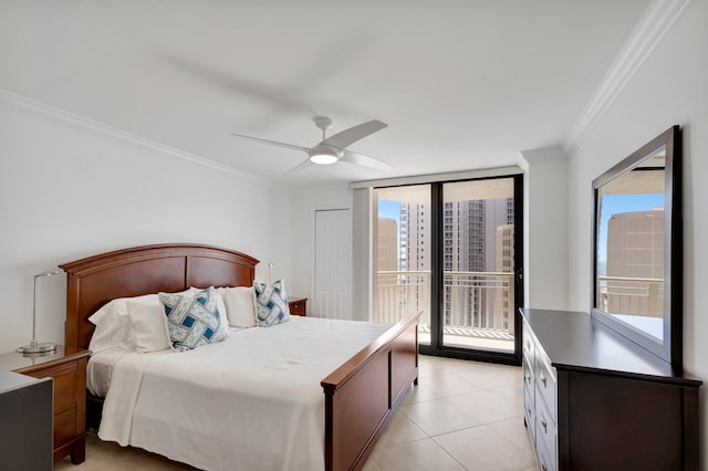 tiled bedroom with ceiling fan, access to outside, and multiple windows