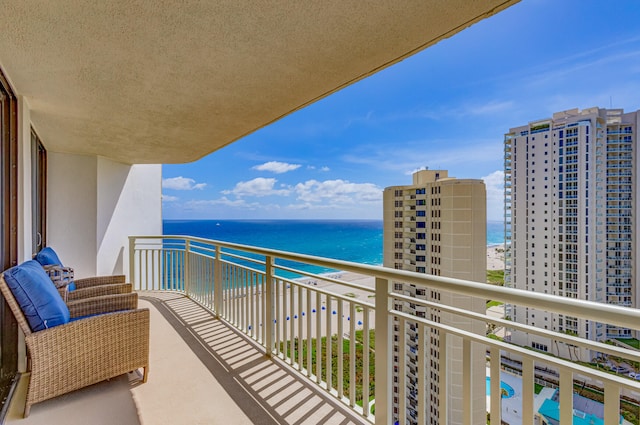 balcony featuring a water view