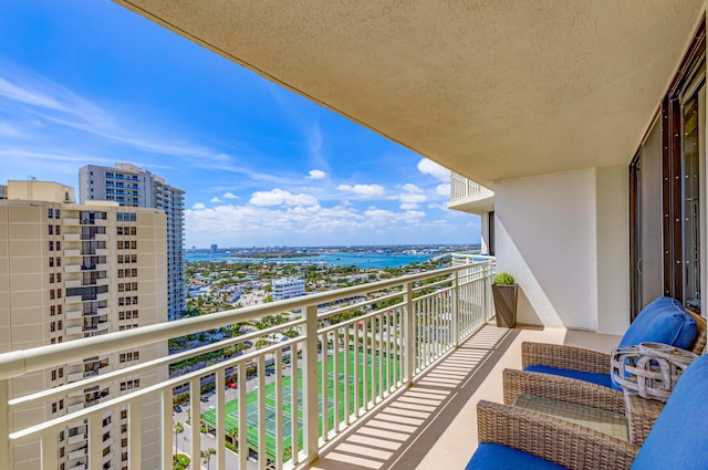 balcony featuring a water view