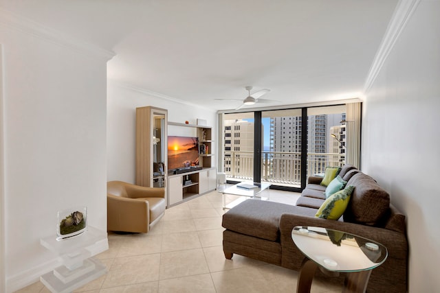 living room with ornamental molding, expansive windows, ceiling fan, and light tile floors