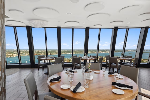 dining room with a water view and a wealth of natural light