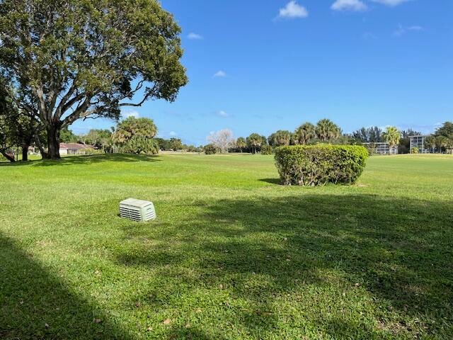 surrounding community with a lawn