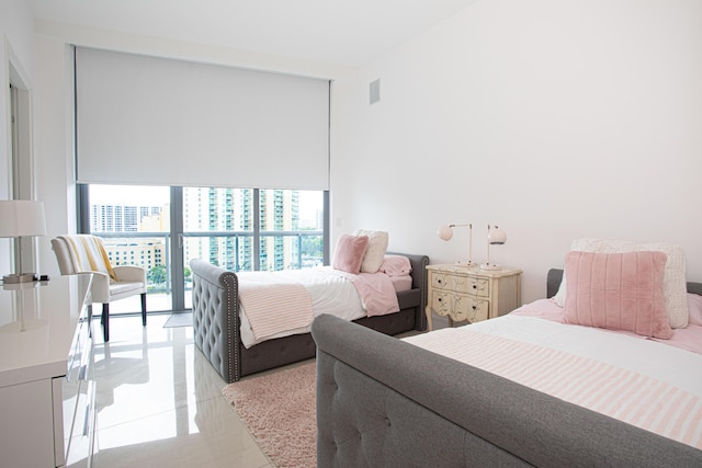 bedroom with floor to ceiling windows