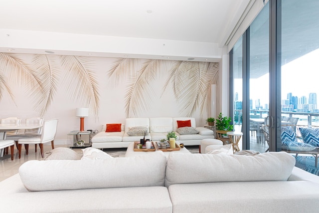 living area with a skyline view and a wall of windows