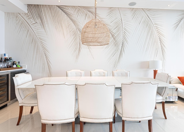 dining area featuring a bar, beverage cooler, and light tile patterned floors