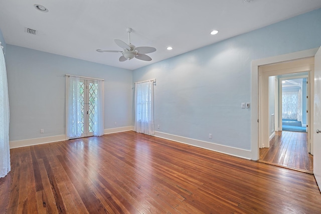 unfurnished room featuring ceiling fan, dark hardwood / wood-style flooring, and french doors