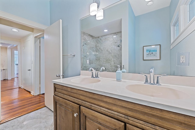 bathroom featuring tile patterned flooring, vanity, and an enclosed shower