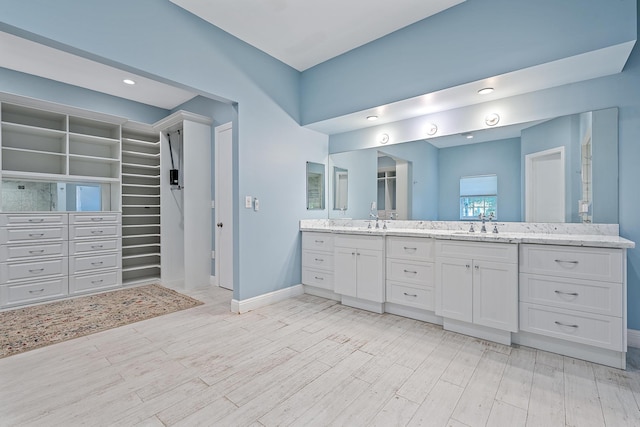 bathroom featuring vanity and wood-type flooring