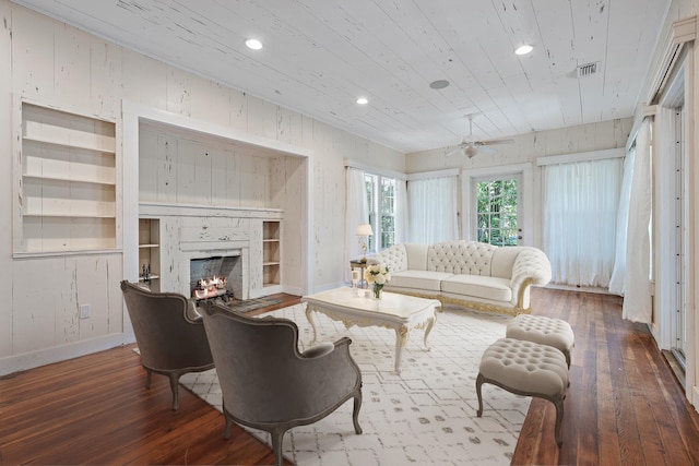 living room featuring hardwood / wood-style floors and ceiling fan