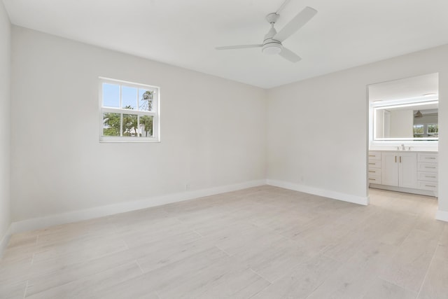 unfurnished room featuring ceiling fan, sink, and light hardwood / wood-style flooring