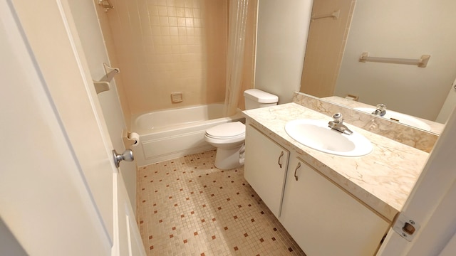 full bathroom featuring oversized vanity, toilet, tile floors, and tiled shower / bath