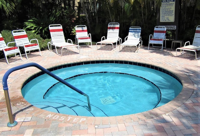 view of pool with a community hot tub