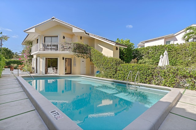 view of swimming pool featuring a patio area