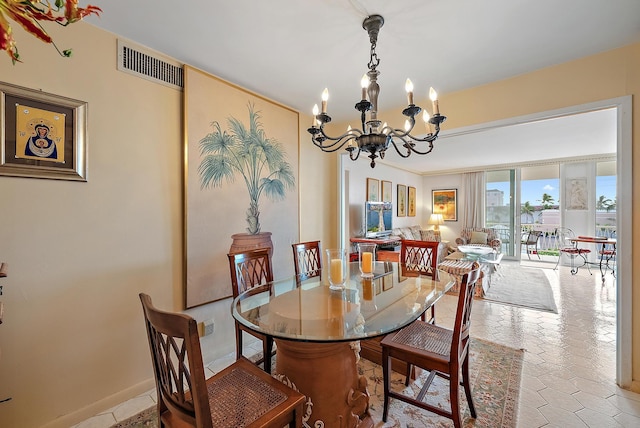 dining area featuring an inviting chandelier