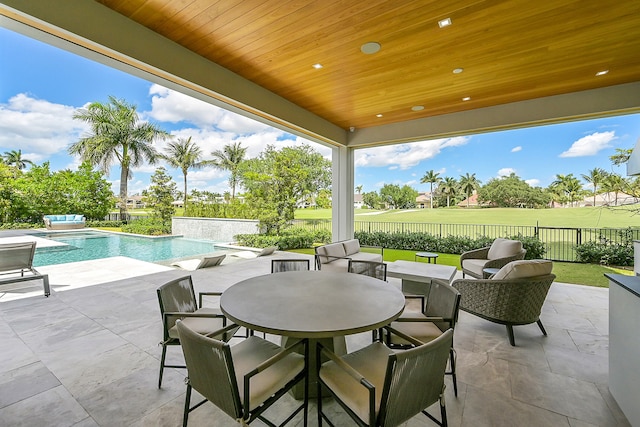 view of terrace featuring a fenced in pool