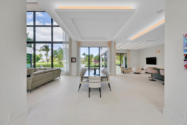 dining room featuring plenty of natural light and a wall of windows