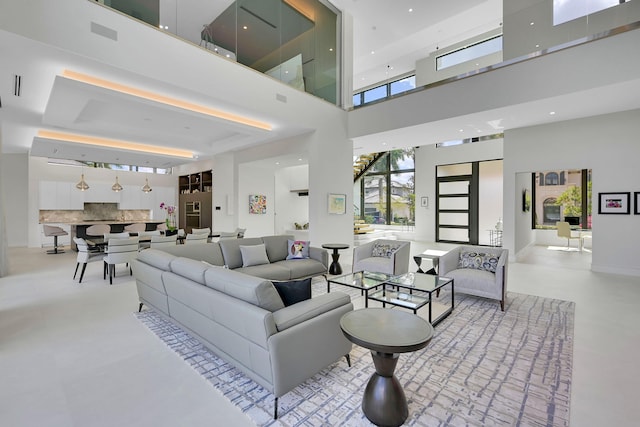 living room with a towering ceiling