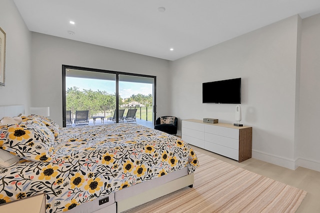 bedroom featuring light hardwood / wood-style flooring and access to exterior