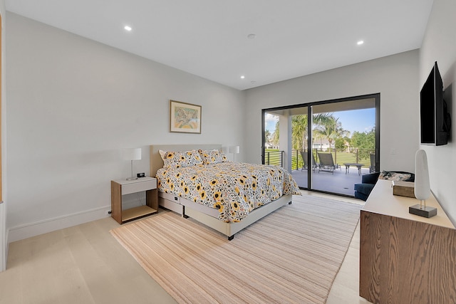 bedroom featuring light hardwood / wood-style floors and access to outside