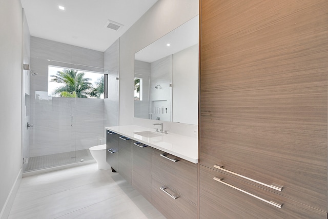 bathroom featuring plus walk in shower, tile floors, and vanity with extensive cabinet space