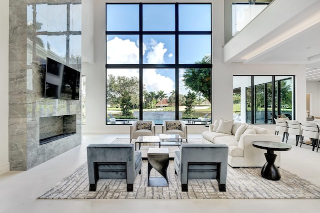 living room featuring a towering ceiling