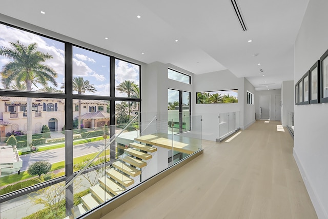 hall with light hardwood / wood-style flooring