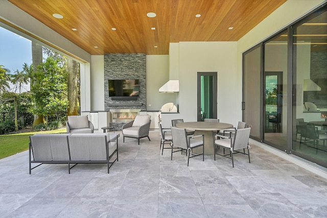 view of patio / terrace featuring an outdoor living space with a fireplace