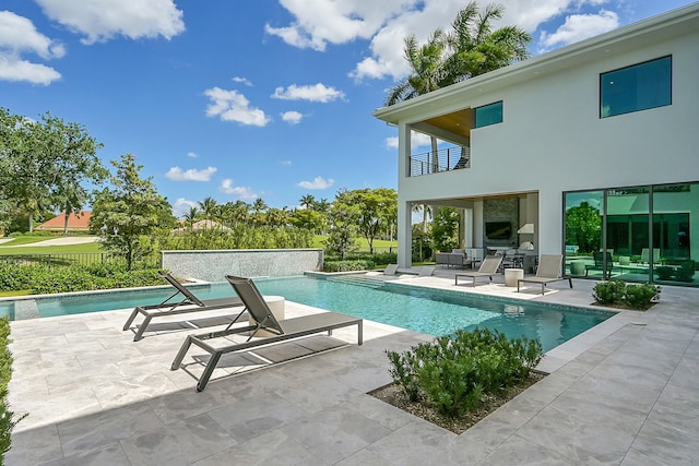 view of swimming pool featuring outdoor lounge area and a patio area