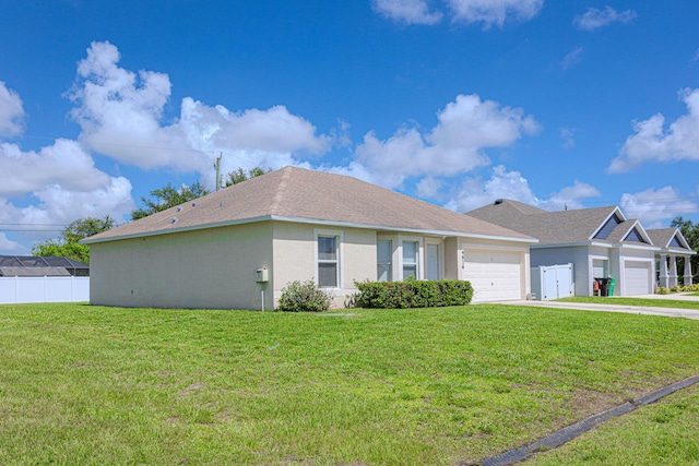 single story home featuring a garage and a front lawn