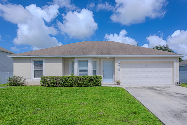 view of front of house featuring a garage and a front yard