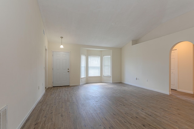 unfurnished room with high vaulted ceiling and hardwood / wood-style floors