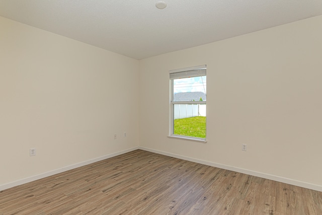 unfurnished bedroom featuring a closet and light wood-type flooring