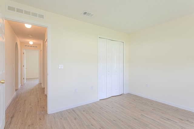 unfurnished room featuring hardwood / wood-style floors