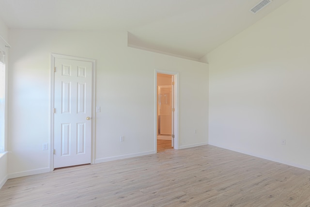 unfurnished bedroom with light hardwood / wood-style flooring and a closet