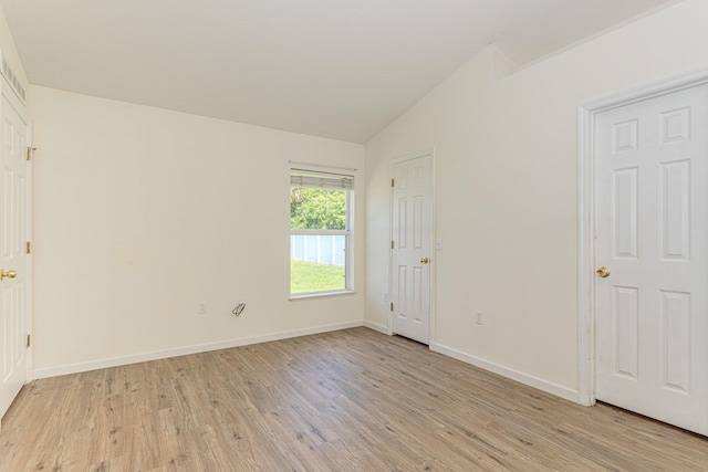 bathroom featuring vanity, hardwood / wood-style flooring, and washtub / shower combination