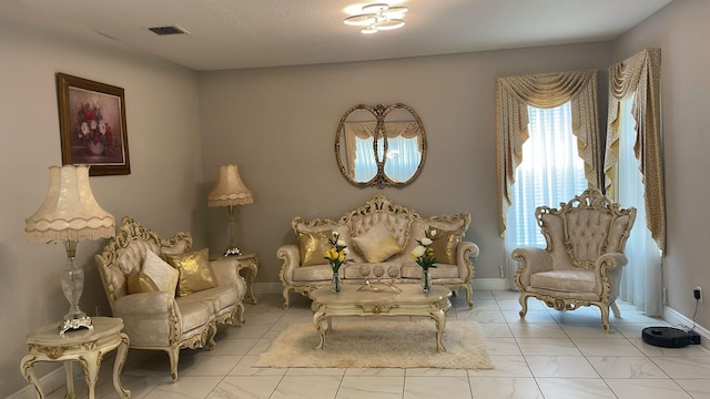 living area featuring light tile floors