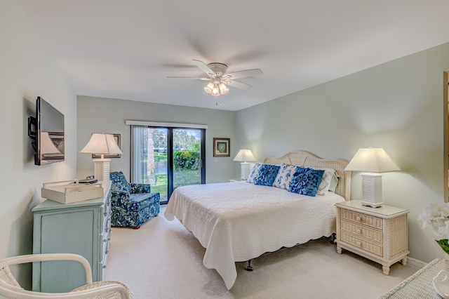 bedroom with light carpet, access to outside, and ceiling fan