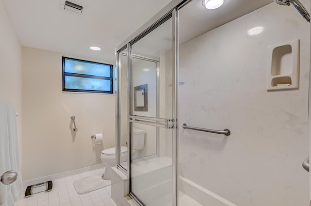 bathroom featuring toilet and tile flooring