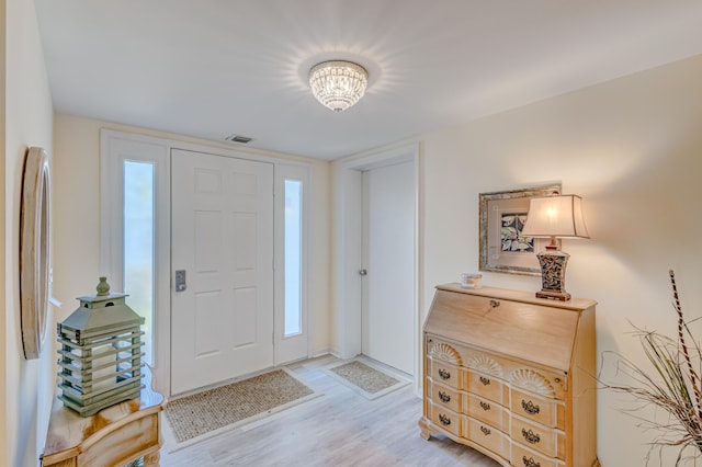 entrance foyer with light hardwood / wood-style flooring