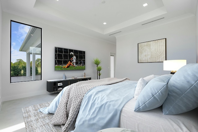 bedroom with crown molding and a tray ceiling