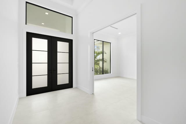 tiled entrance foyer with french doors