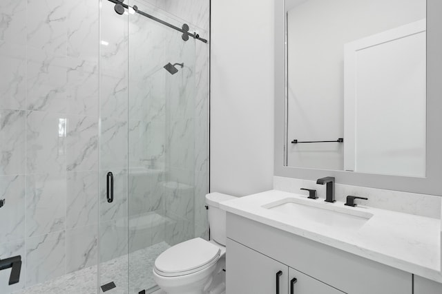 bathroom with vanity, toilet, and a shower with shower door